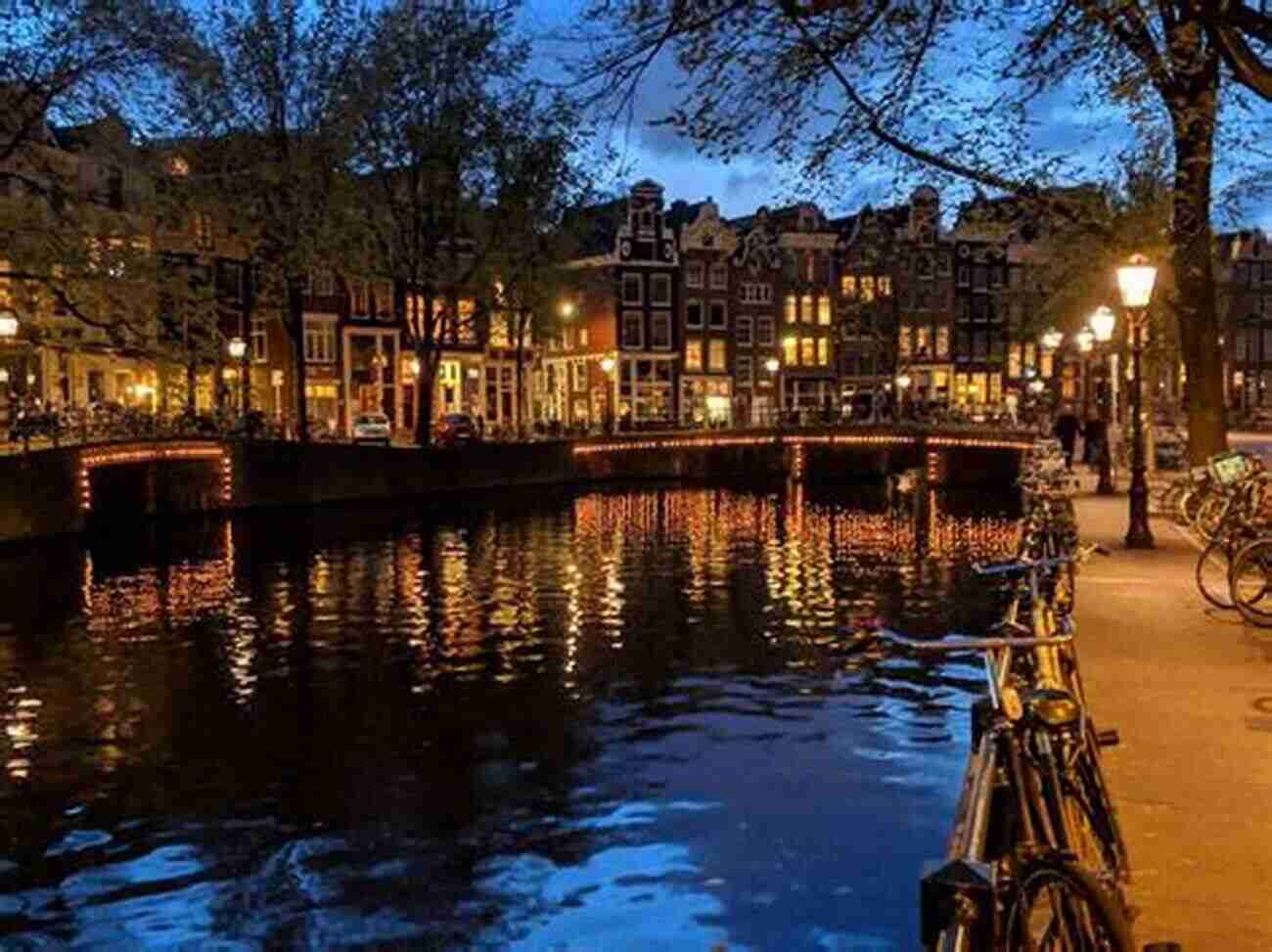 An Enchanting View Of The Amsterdam Canals At Dusk, With Beautifully Illuminated Buildings Reflected On The Calm Water Photo Essay: Beauty Of The Netherlands: Volume 62B (Travel Photo Essays)