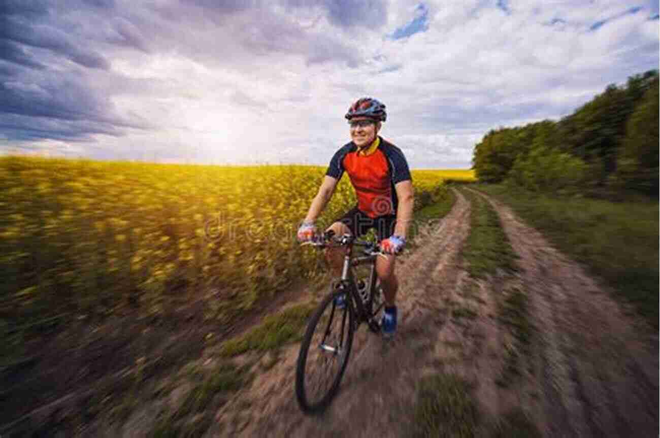 Cyclist Riding Through A Picturesque Field In The Normandy Countryside Downhill All The Way: From La Manche To The Mediterranean By Bike